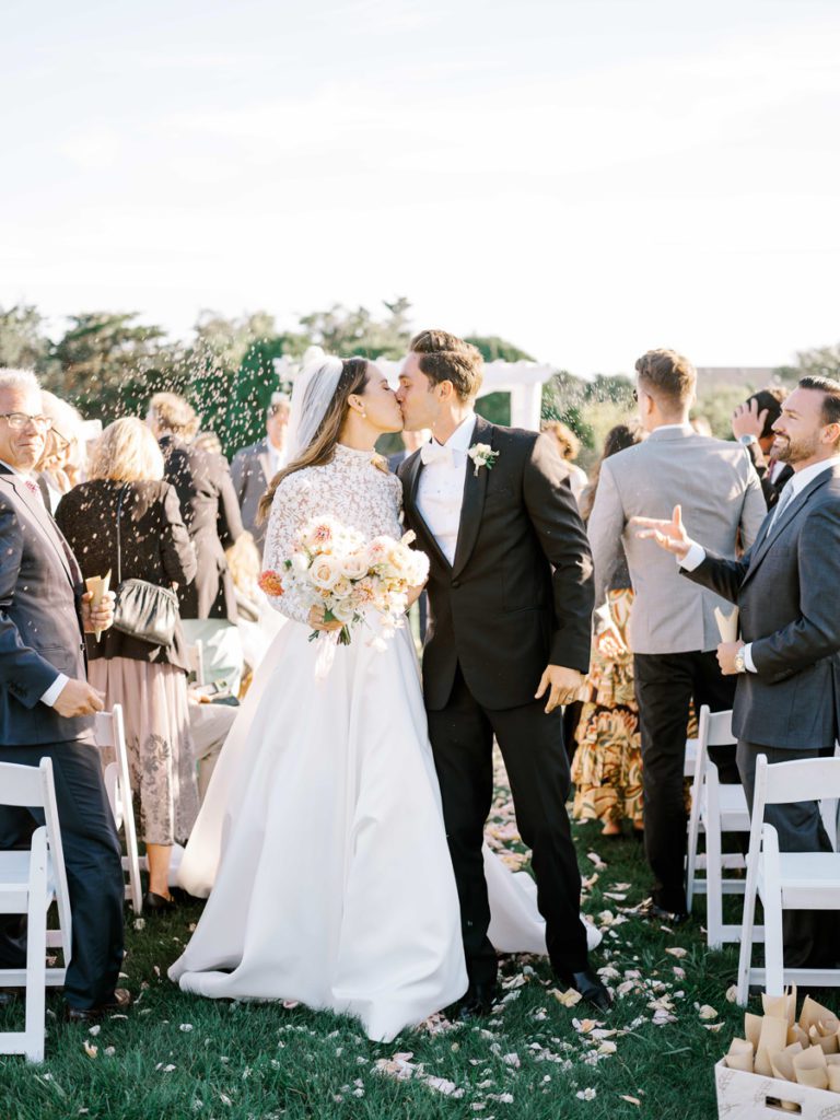 ceremony exit kiss with lavender confetti