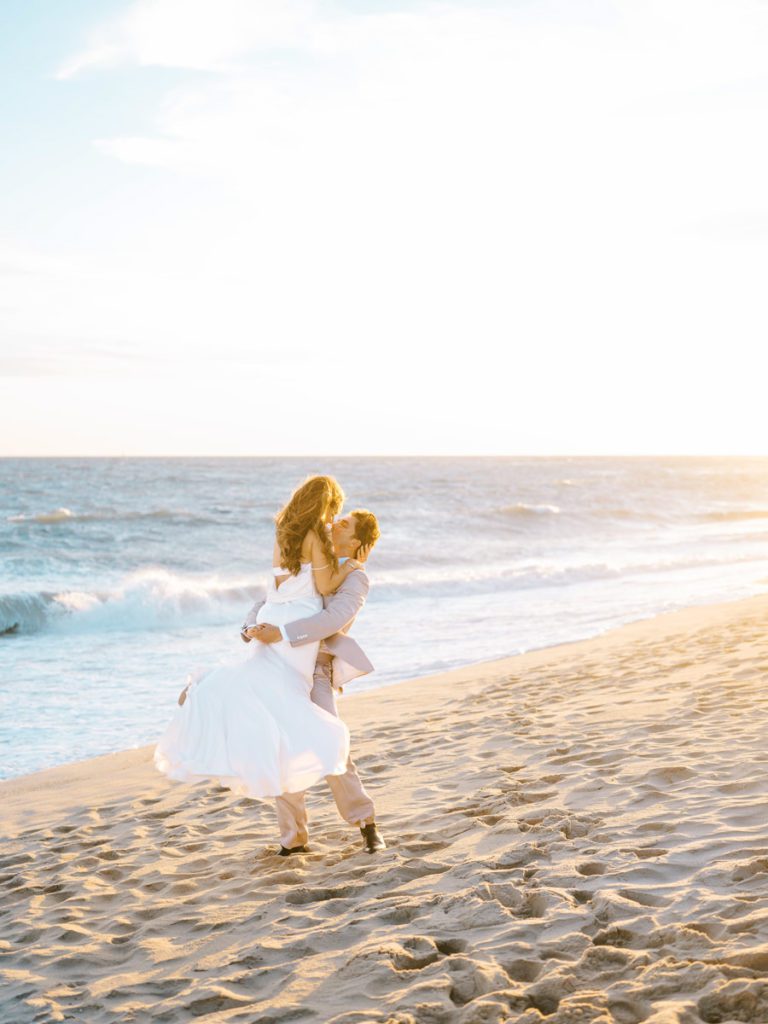 Portraits of the Bride and groom at the beach during golden hour