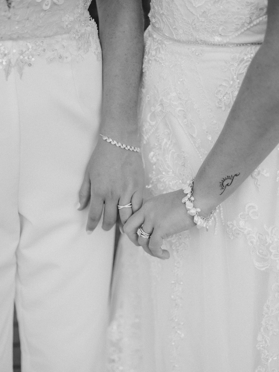 two brides holing hands