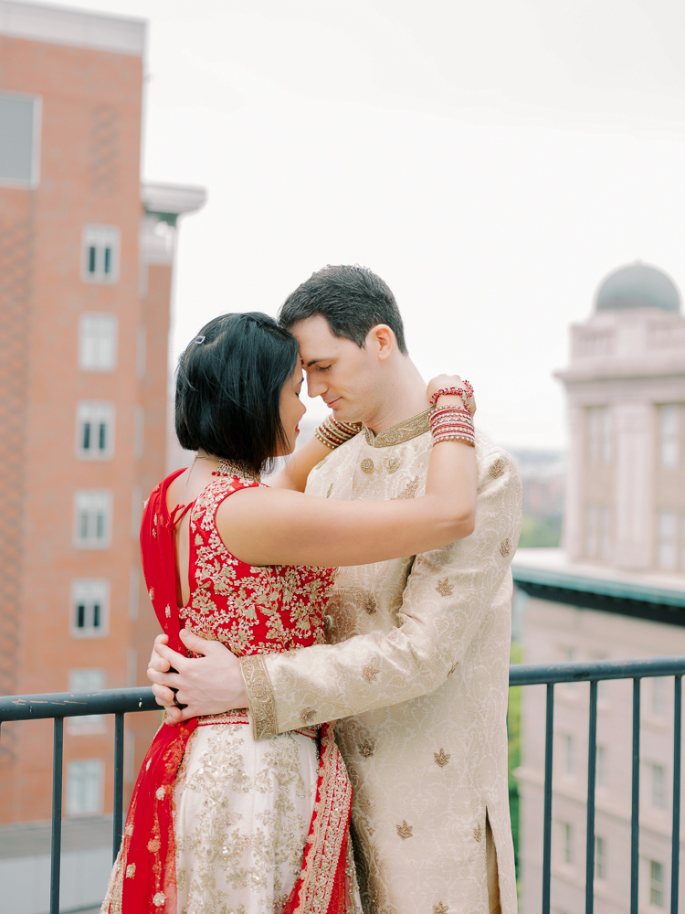 Indian Wedding Bride and Groom portrait with Red and Tan Saree and Tan sherwani