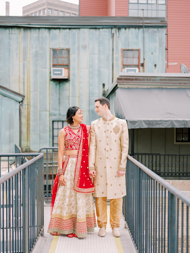 Indian Wedding Couple in Red and Tan Saree and Tan sherwani